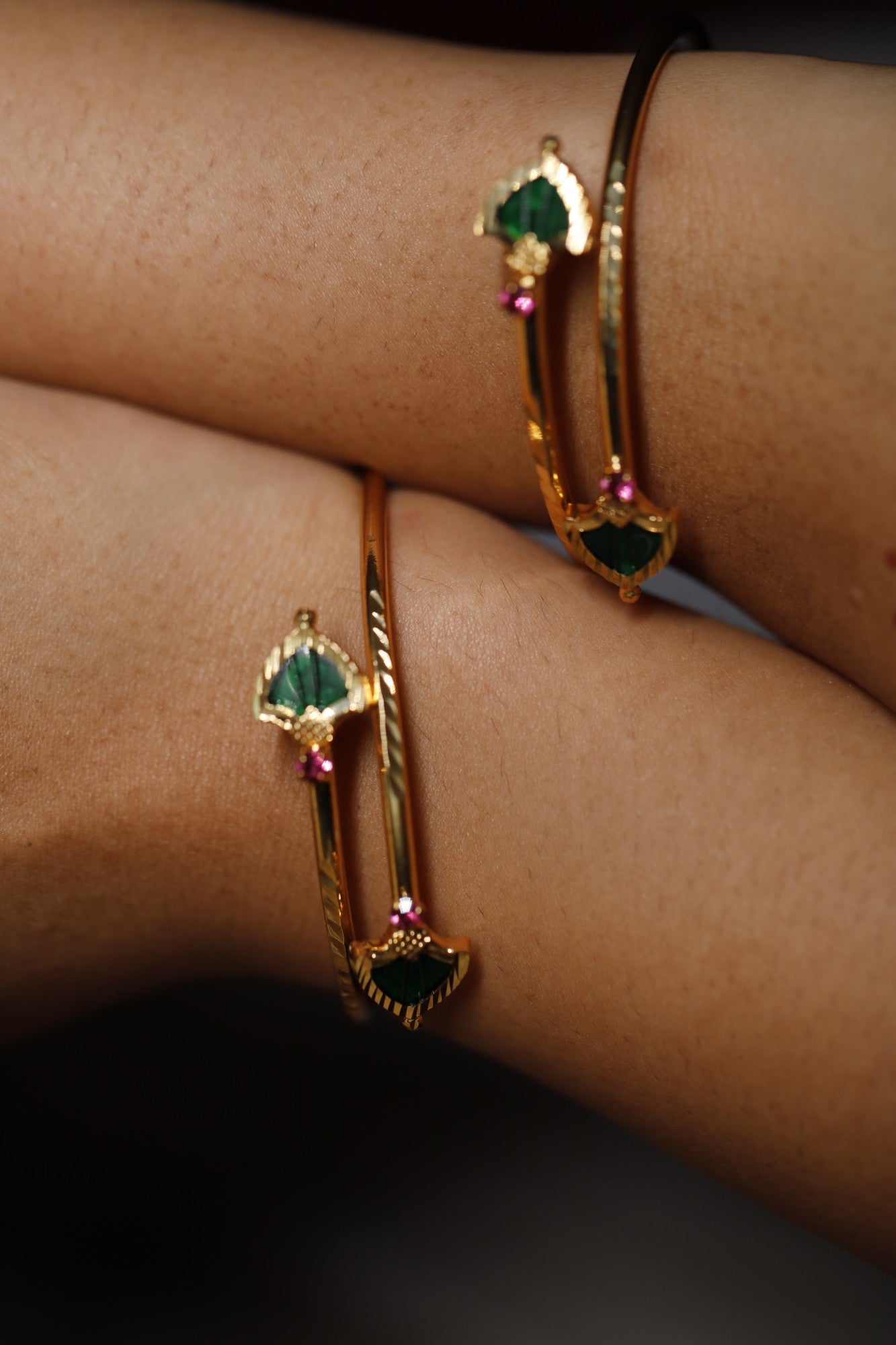 Gold plated Green Palakka stone and ruby red AD stone ajustable bangles styled on wrist