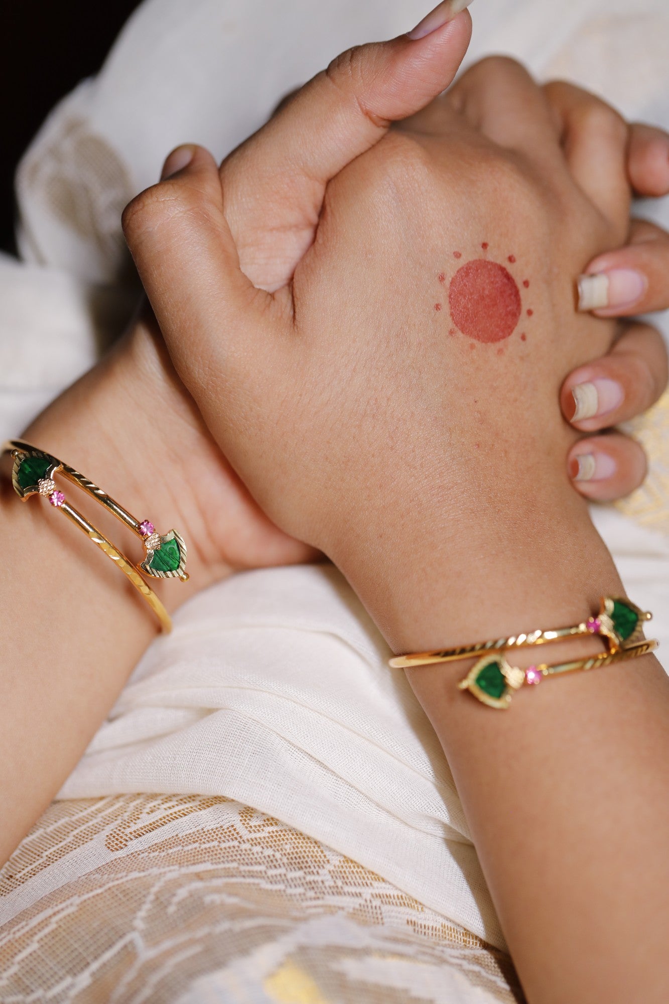 Gold plated Green Palakka stone and ruby red AD stone ajustable bangles styled on hands